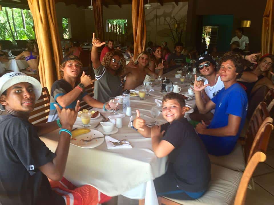 The youth and Costa Rican Surf Hero, Carlos Munoz, sharing a local meal