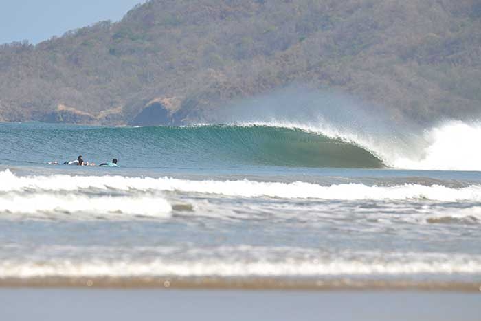 Empty wave breaking at the Tamarindo Rivermouth