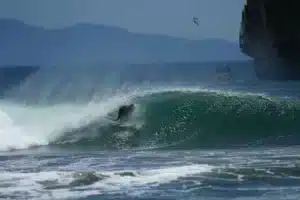 Advanced surfer riding wave at Witch’s Rock Costa Rica